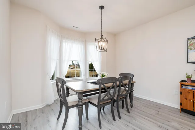 a kitchen with a faucet a sink and a flat screen tv