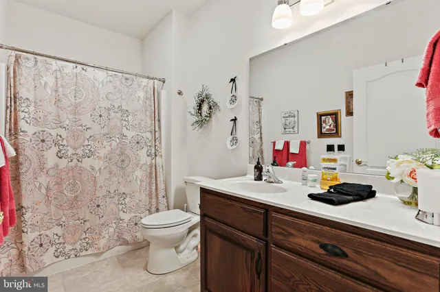 a bedroom with a bed and a dresser in it