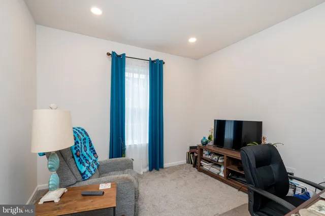 a bathroom with a sink a toilet and a shower curtain