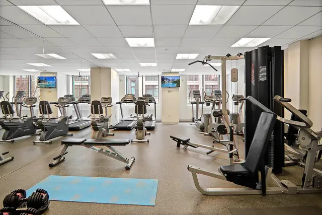a bathroom with a toilet sink and shower