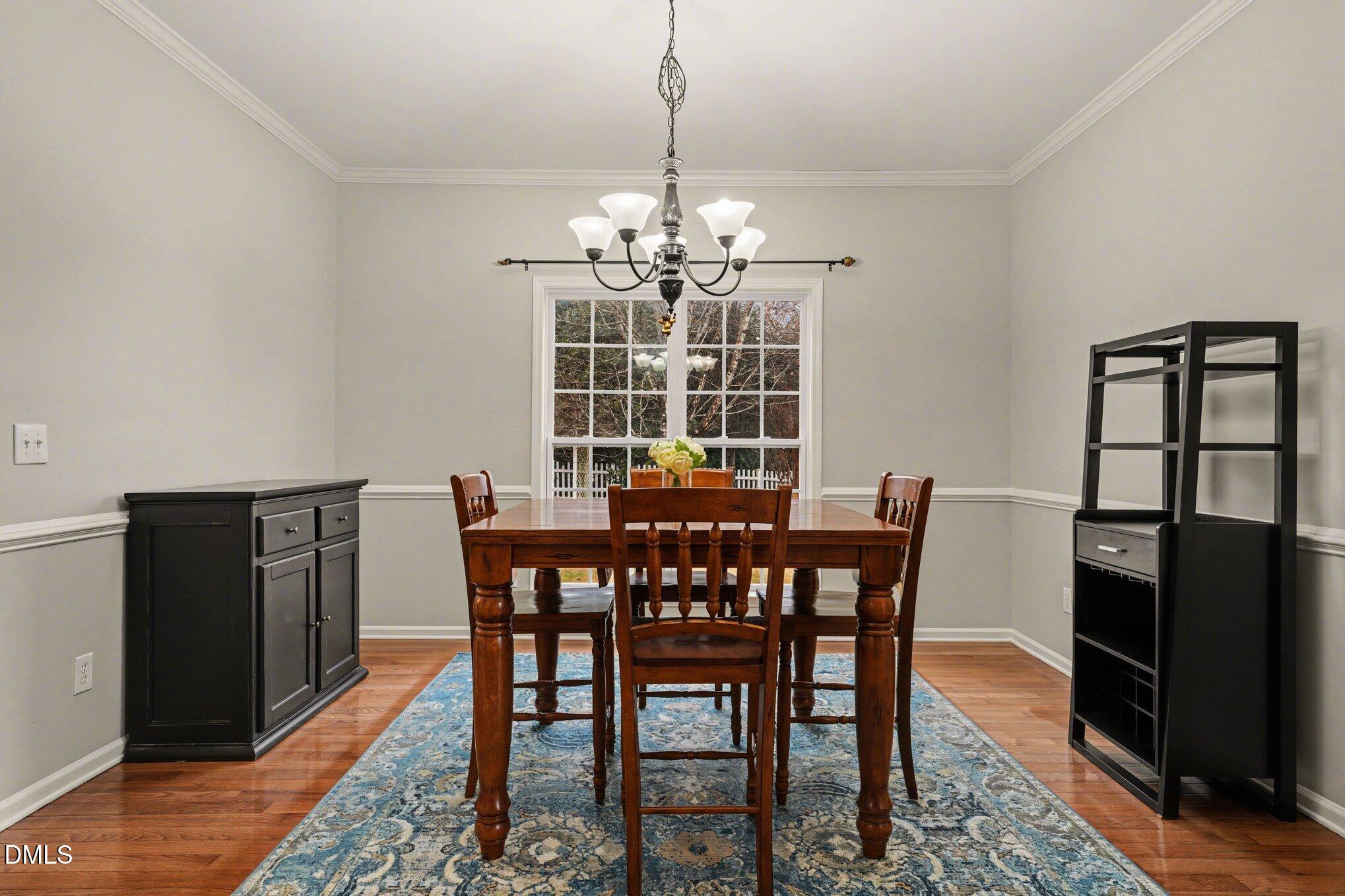 2505 Wyatt Lane Raleigh, NC 27614 - Photo 11 of 54 a view of a dining room with furniture window and wooden floor