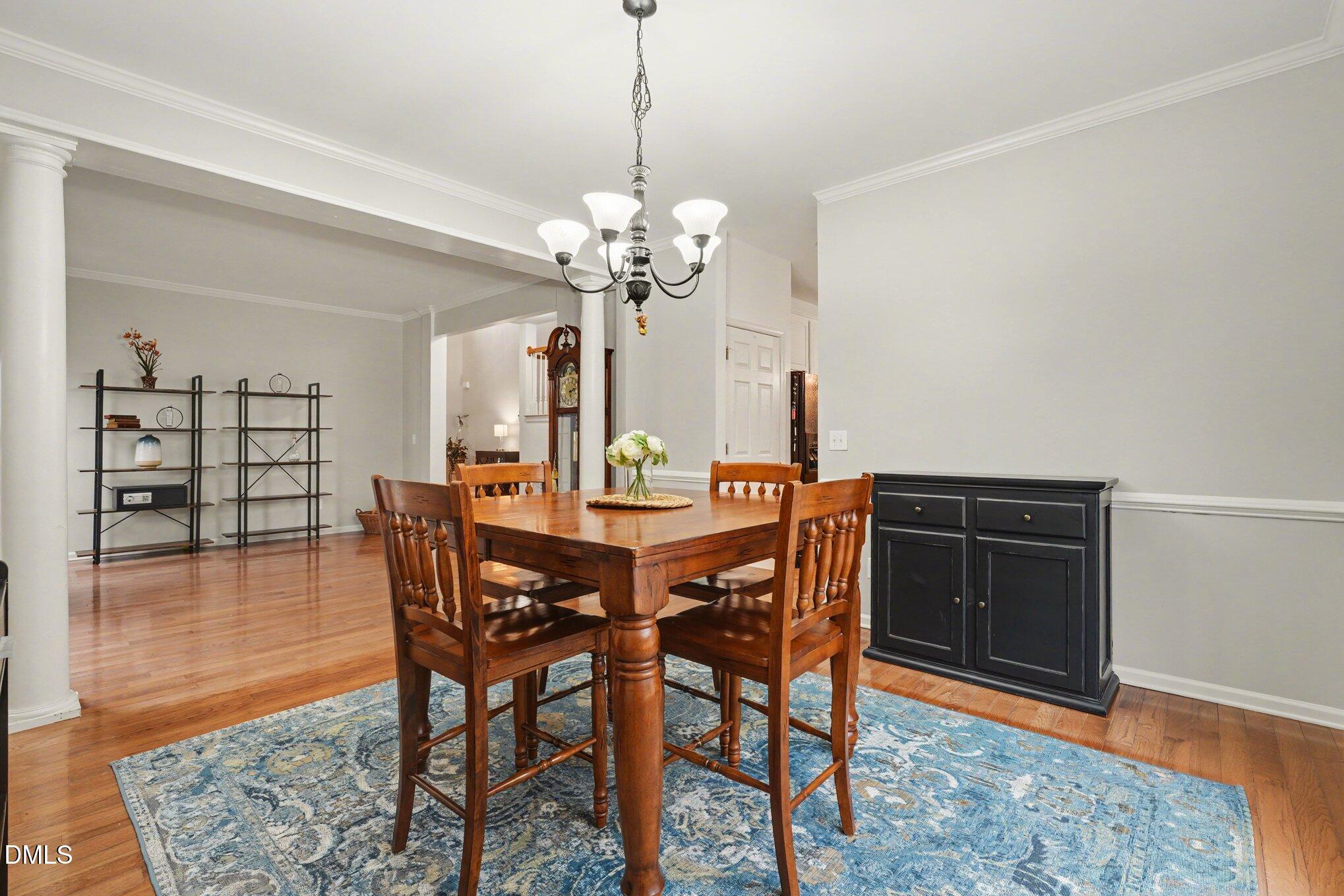 2505 Wyatt Lane Raleigh, NC 27614 - Photo 12 of 54 a view of a dining room with furniture and wooden floor