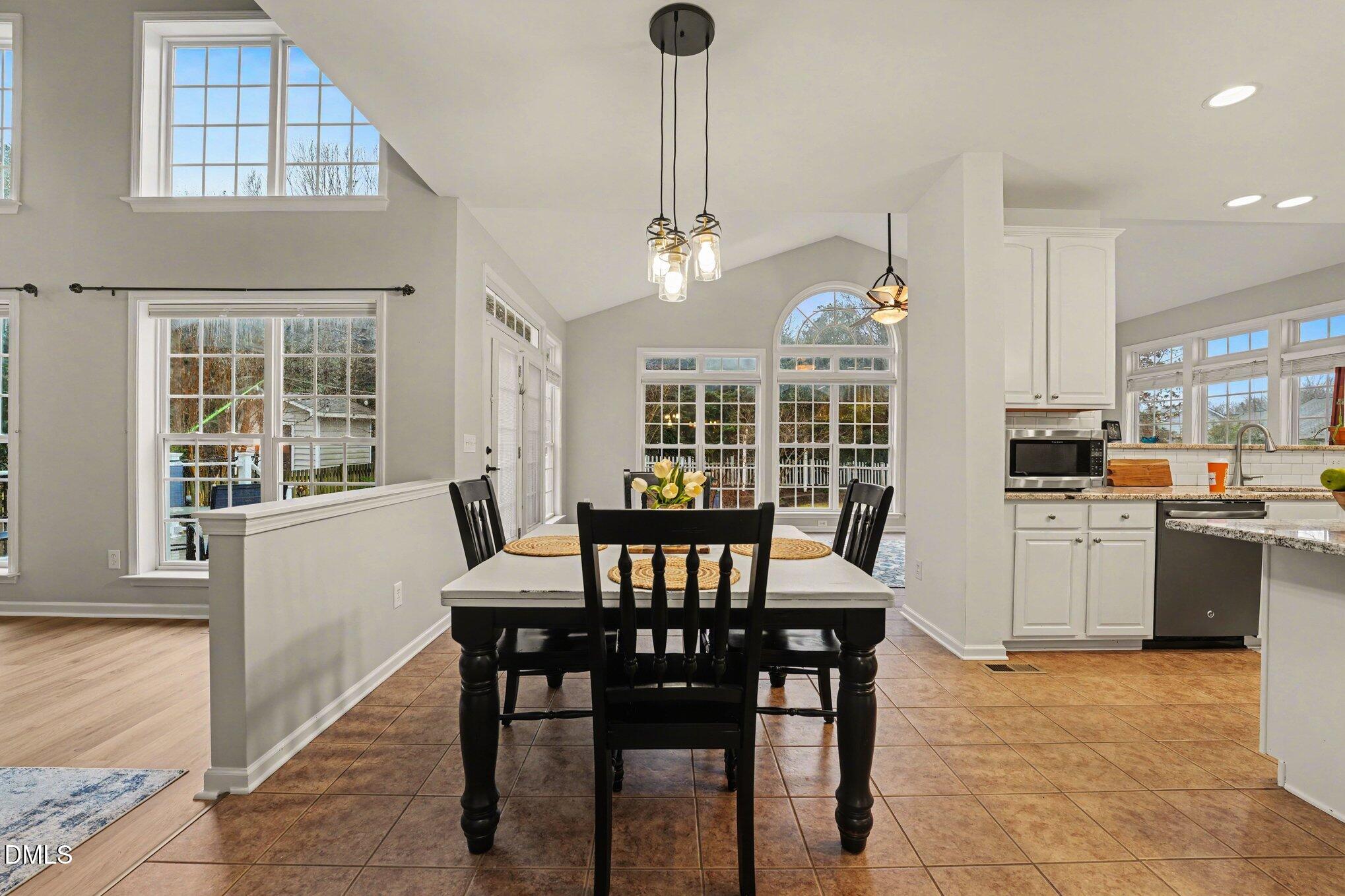 2505 Wyatt Lane Raleigh, NC 27614 - Photo 16 of 54 a view of a dining room with furniture window and outside view