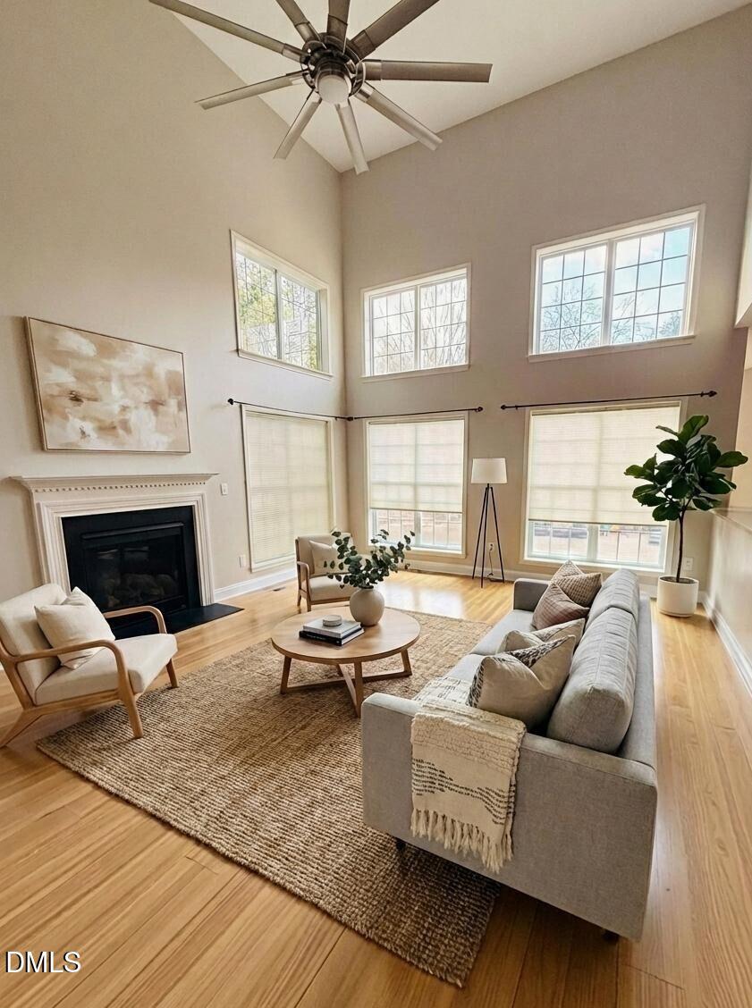 2505 Wyatt Lane Raleigh, NC 27614 - Photo 19 of 54 a living room with furniture and a fireplace