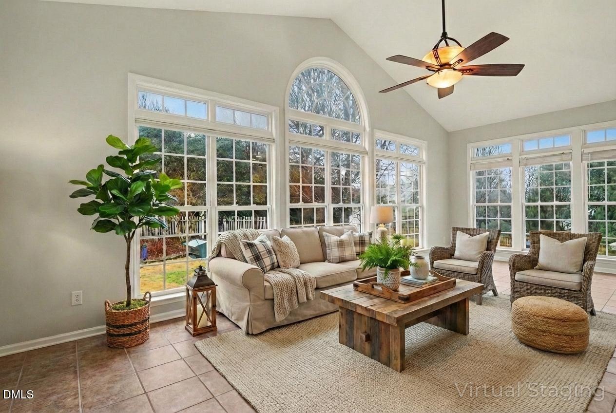 2505 Wyatt Lane Raleigh, NC 27614 - Photo 21 of 54 a living room with furniture a chandelier and a large window