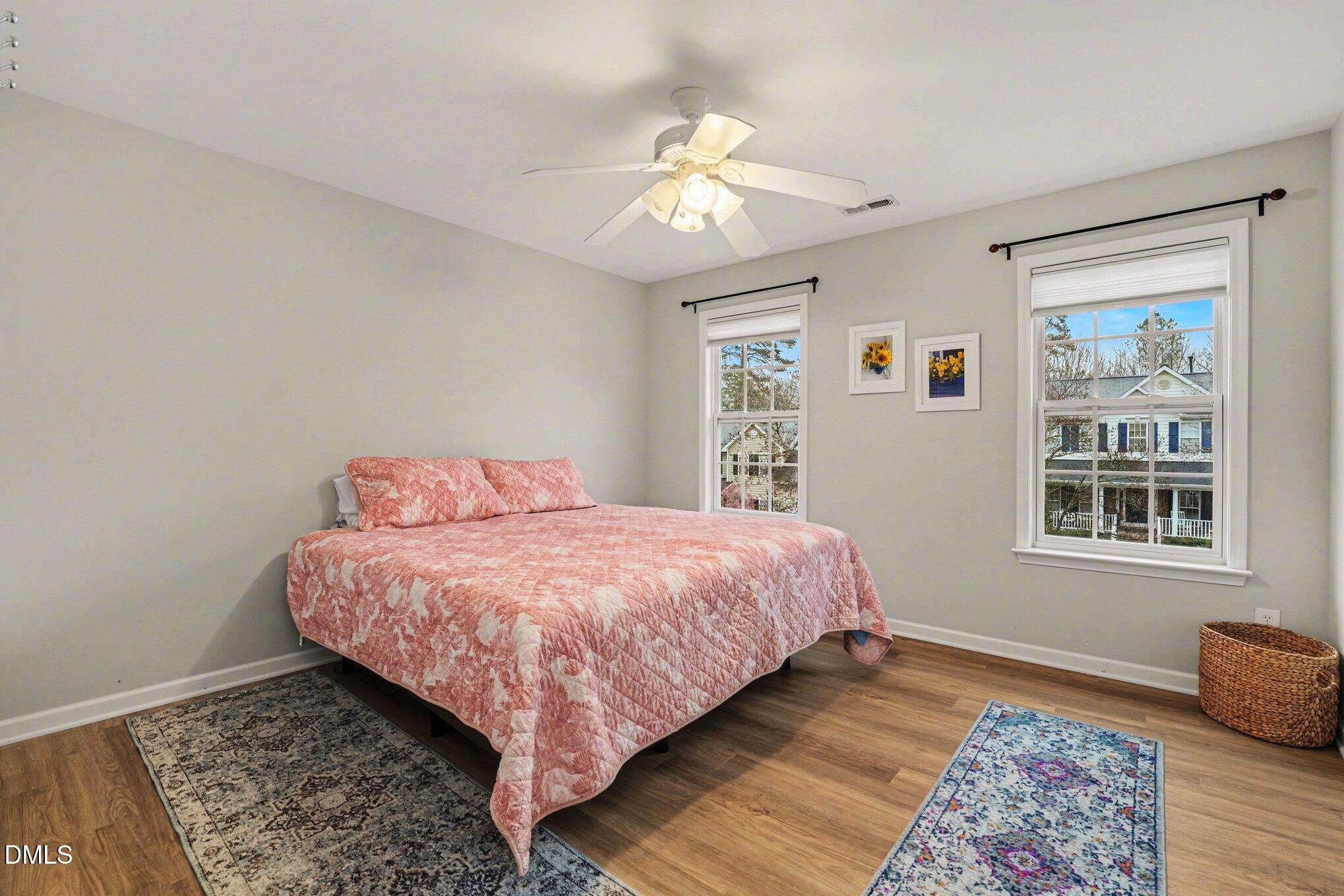 2505 Wyatt Lane Raleigh, NC 27614 - Photo 28 of 54 a bedroom with a bed dresser and wooden floor