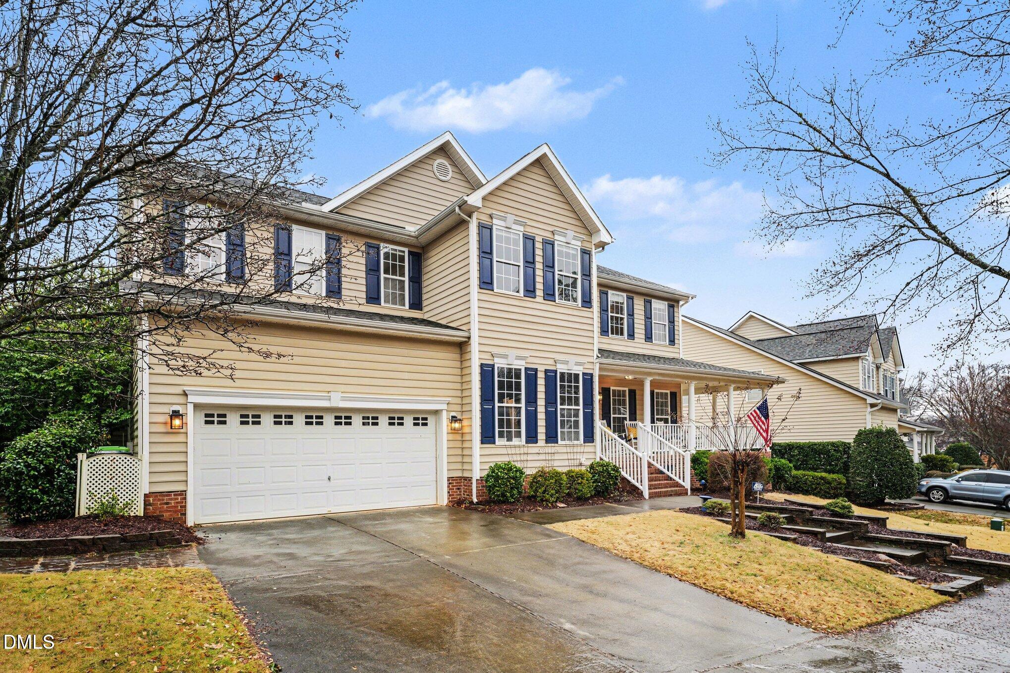 2505 Wyatt Lane Raleigh, NC 27614 - Photo 52 of 54 a view of a white house with large windows next to a road