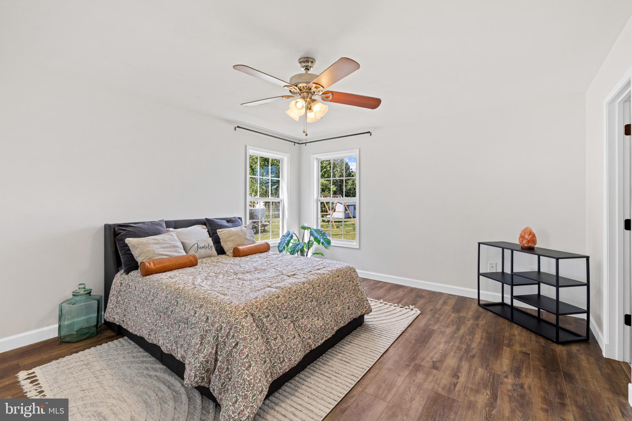 1523 Bowie Road Colonial Beach, VA 22443 - Photo 15 of 34 a bedroom with a bed and a chandelier