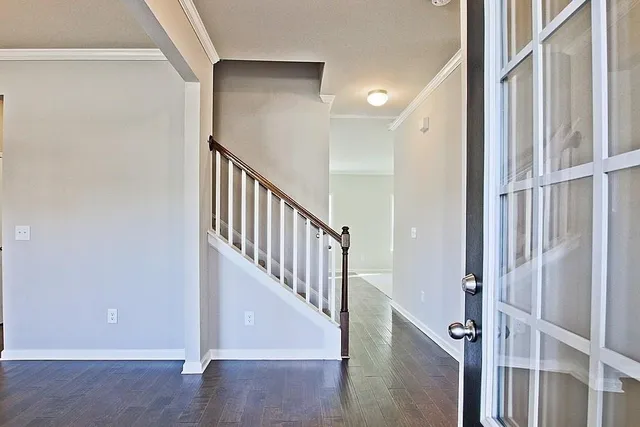 a view of entryway with wooden floor