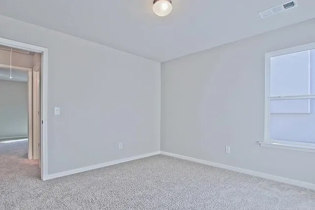 a view of an empty room and entryway