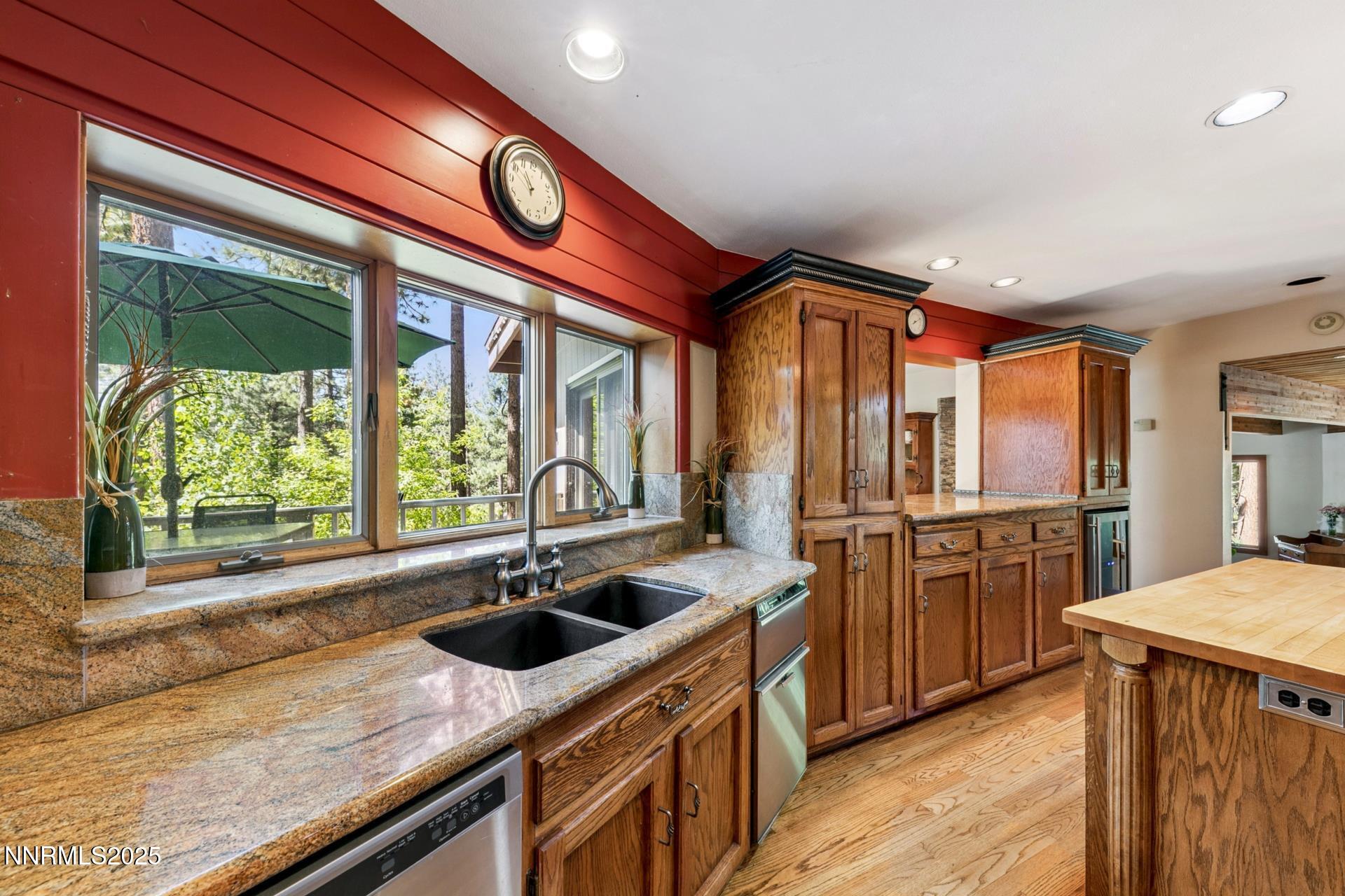 173 Hall Court Stateline, NV 89449 - Photo 12 of 32 a kitchen with stainless steel appliances granite countertop a sink a stove and a refrigerator