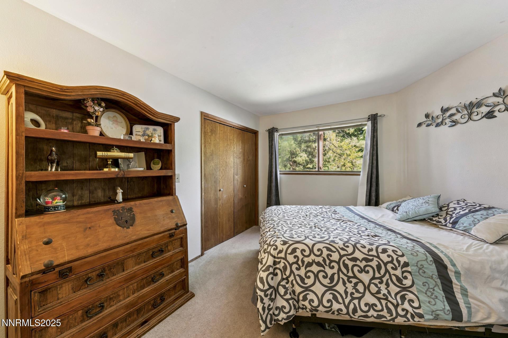 173 Hall Court Stateline, NV 89449 - Photo 22 of 32 a bedroom with a bed and a window