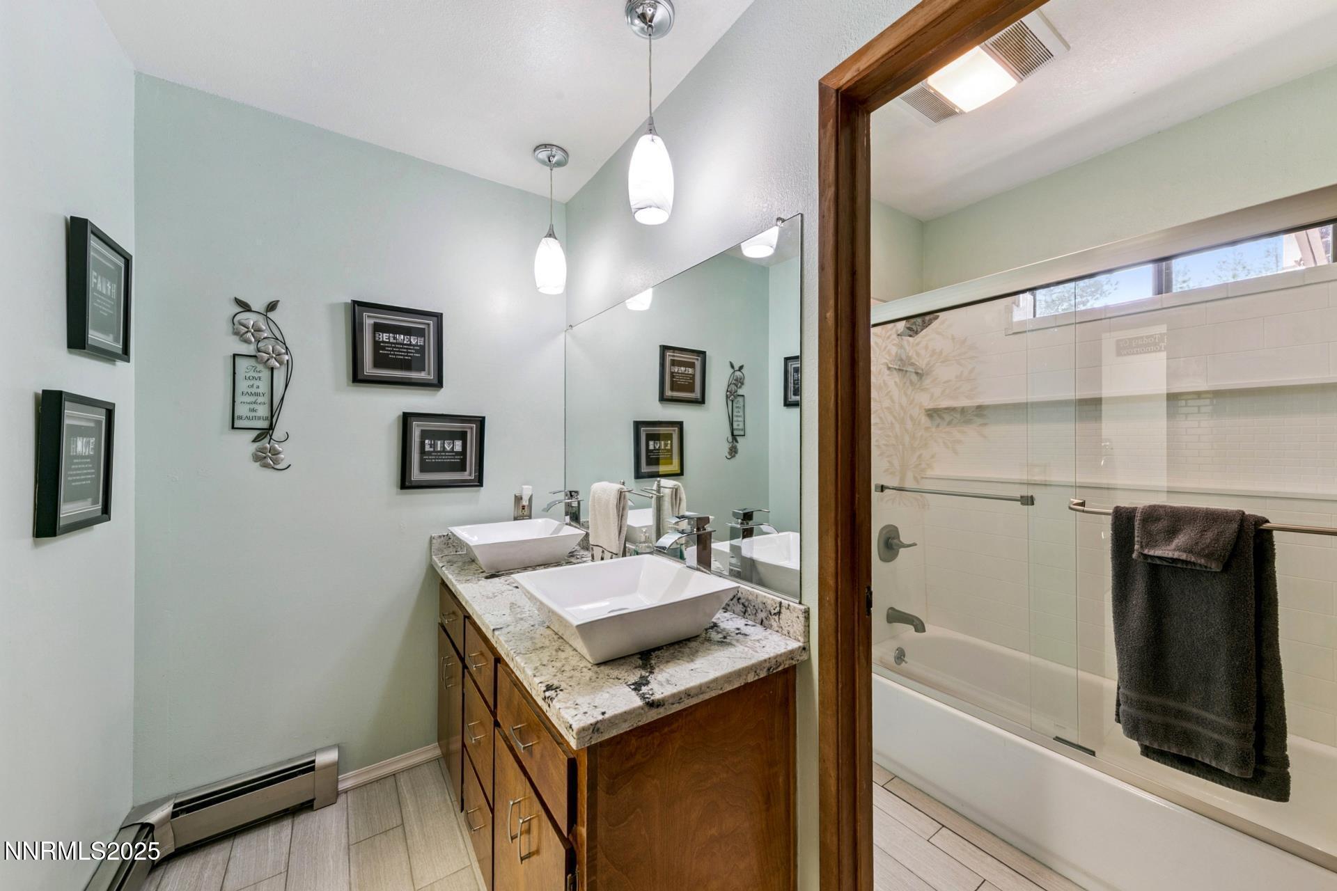 173 Hall Court Stateline, NV 89449 - Photo 24 of 32 a bathroom with a sink a mirror and a shower