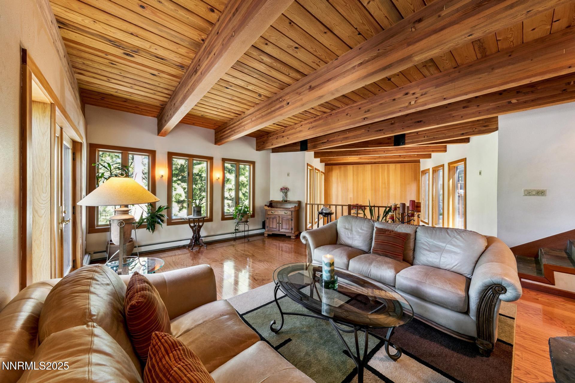 173 Hall Court Stateline, NV 89449 - Photo 10 of 32 a living room with furniture a table and a chandelier