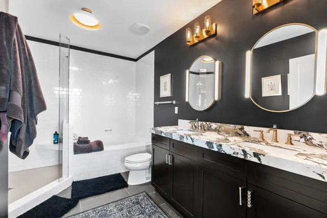 a bathroom with a shower and a mirror