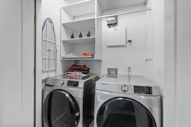 a balcony with table and chairs