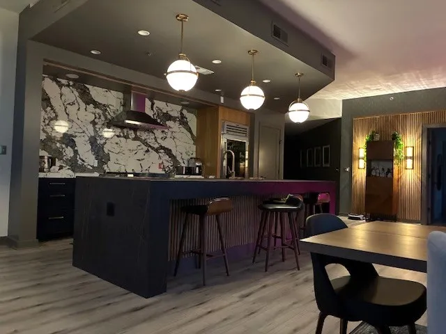 a kitchen with a sink a stove and a refrigerator