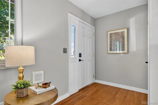 a view of an entryway with wooden floor