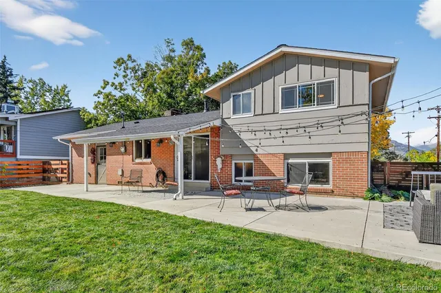 a front view of a house with a yard patio and fire pit