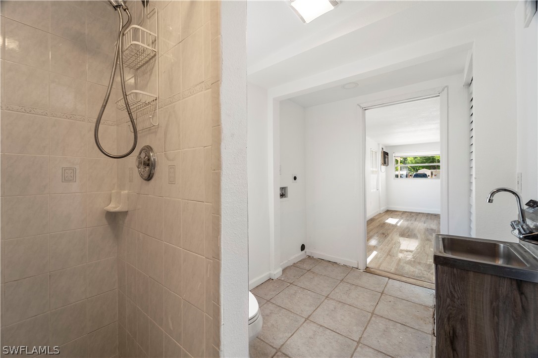 2345 Floyd Street Sarasota, FL 34239 - Photo 21 of 30 a bathroom with a granite countertop shower and a sink