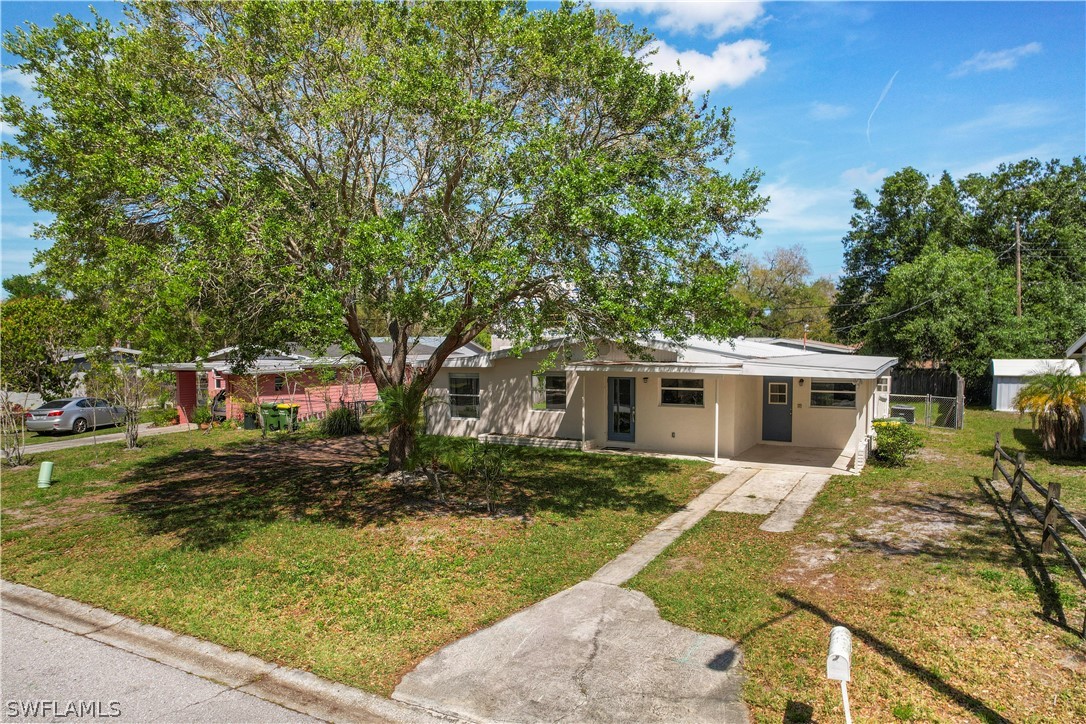 2345 Floyd Street Sarasota, FL 34239 - Photo 23 of 30 a front view of house with yard and trees