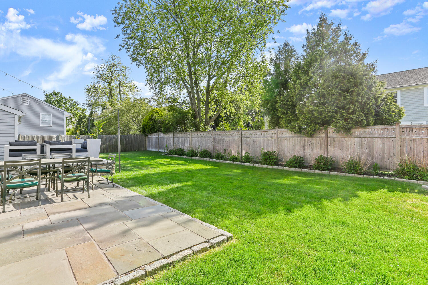 6 Mayflower Road Darien, CT 06820 - Photo 24 of 33 a view of a backyard with sitting area