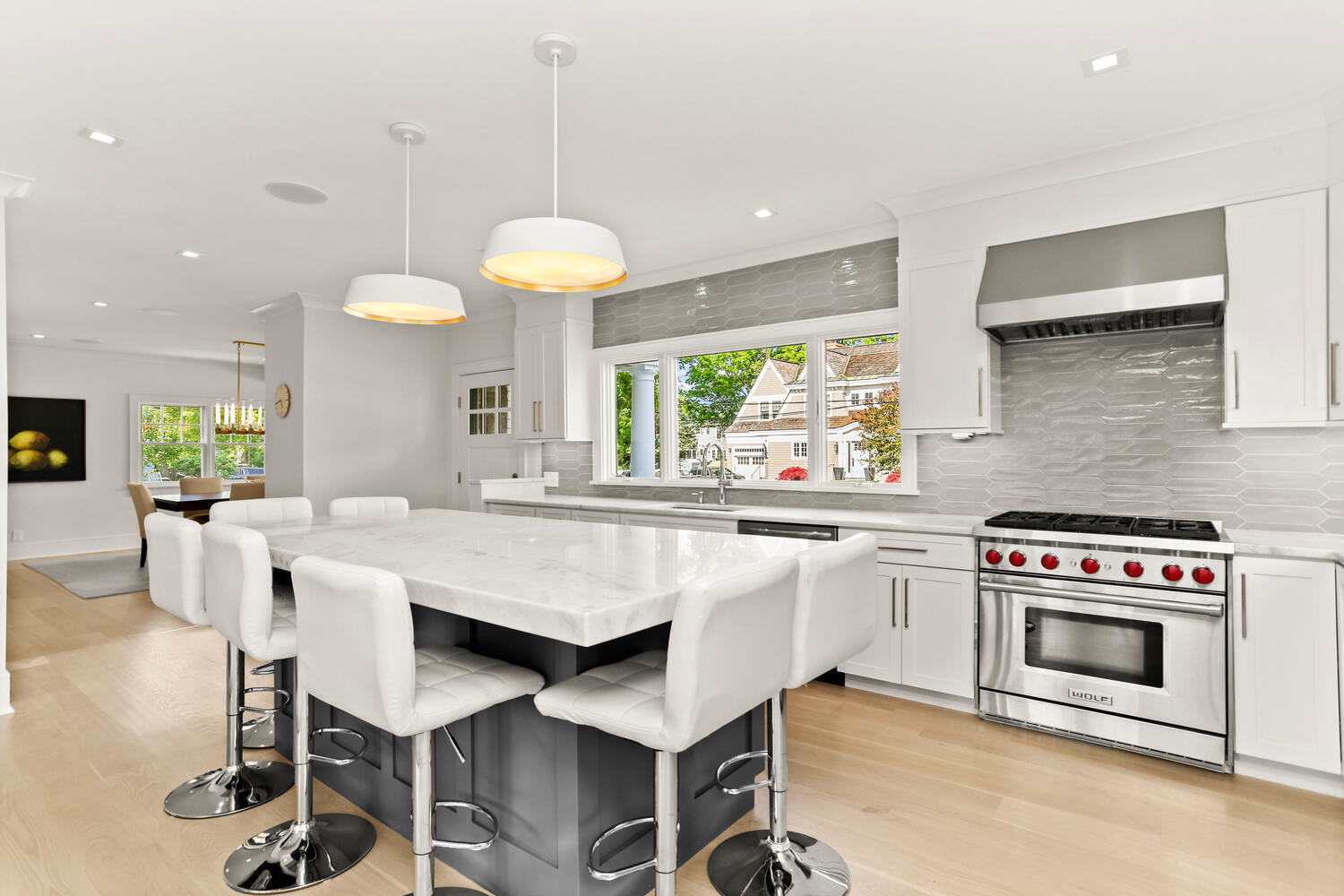 6 Mayflower Road Darien, CT 06820 - Photo 4 of 33 a kitchen with a stove a table and chairs in it