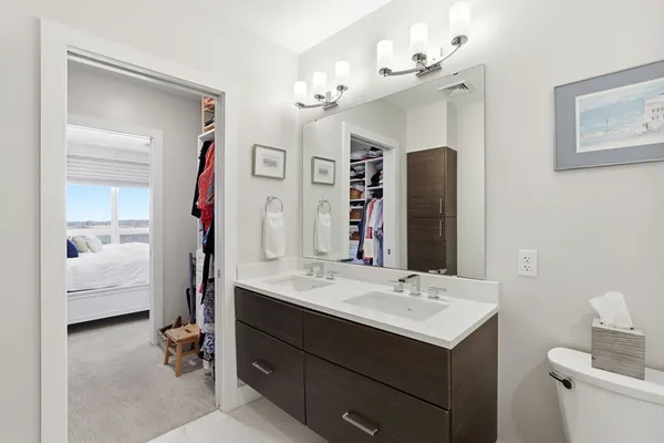 a bathroom with a sink double vanity and a mirror