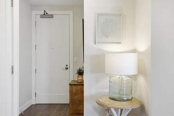 a close view of light fixtures and wooden floor