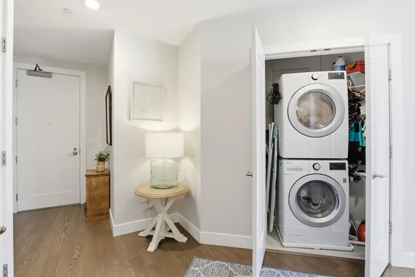 a utility room with sink dryer and washer