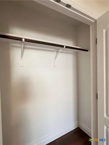 a view of balcony with wooden floor and fence