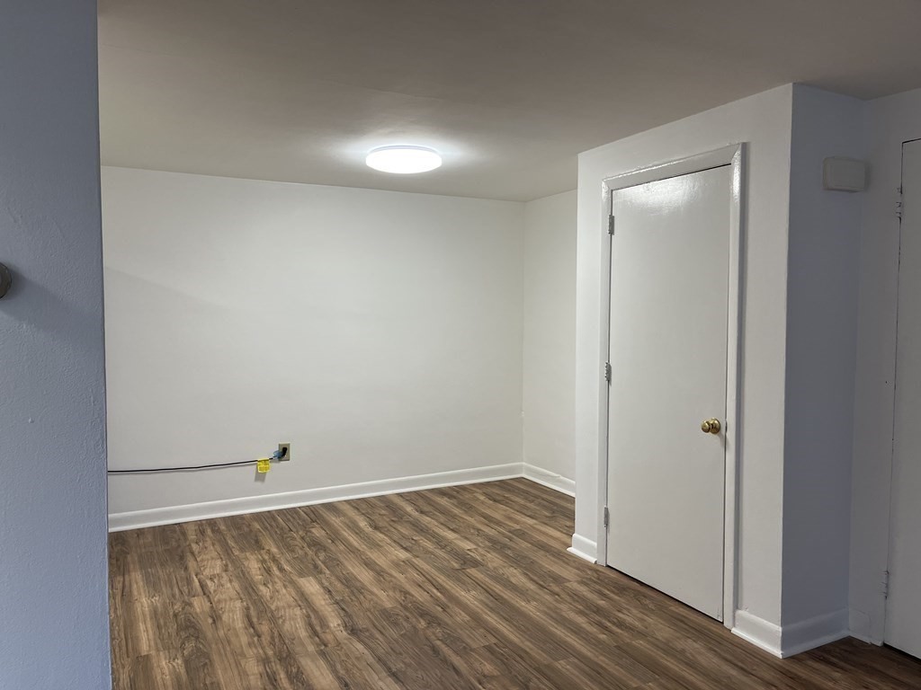300 Main Street, Unit 3 Woburn, MA 01801 - Photo 5 of 9 wooden floor in an empty room