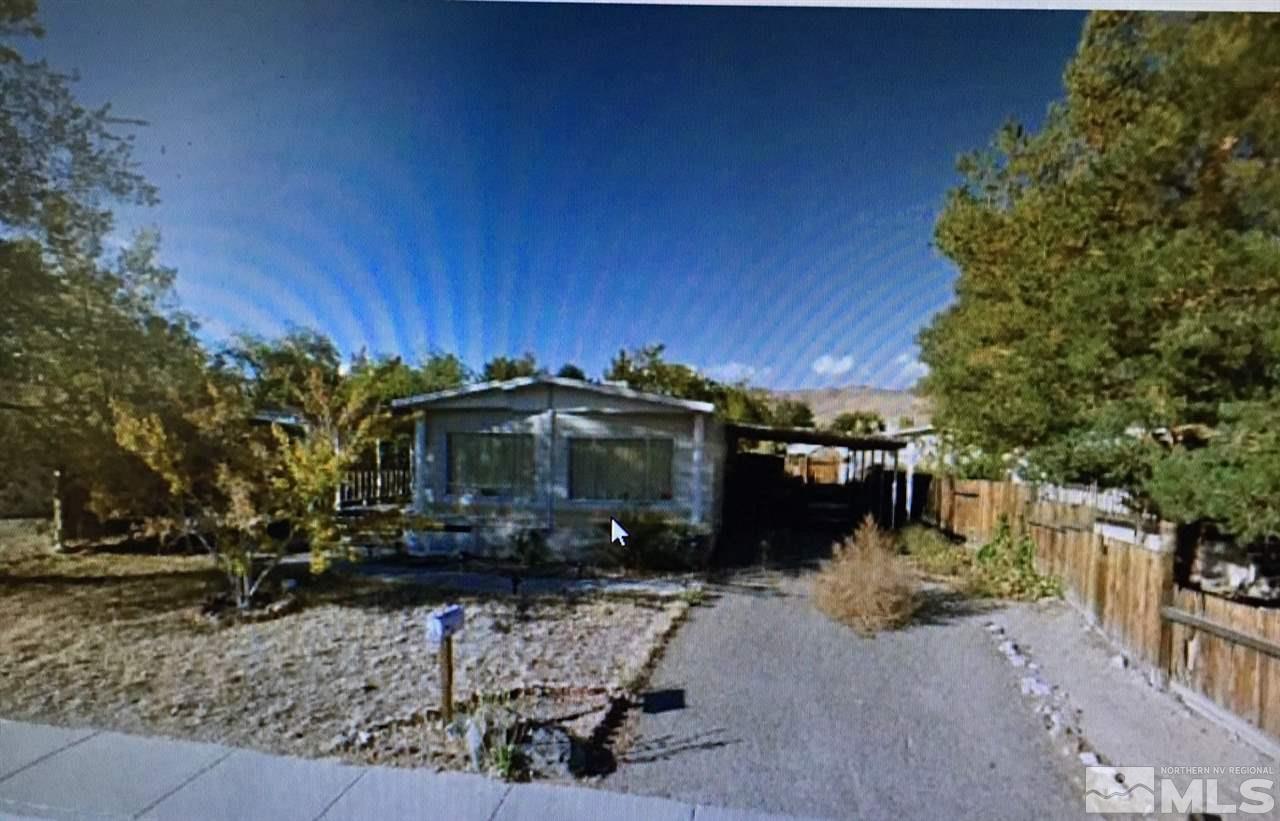 3726 Sherman Lane Carson City, NV 89706 - Photo 1 of 1 a view of a house with a yard