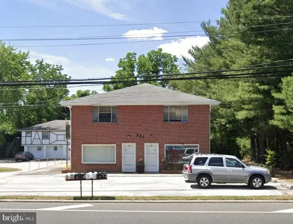 a view of a car parked in front of house