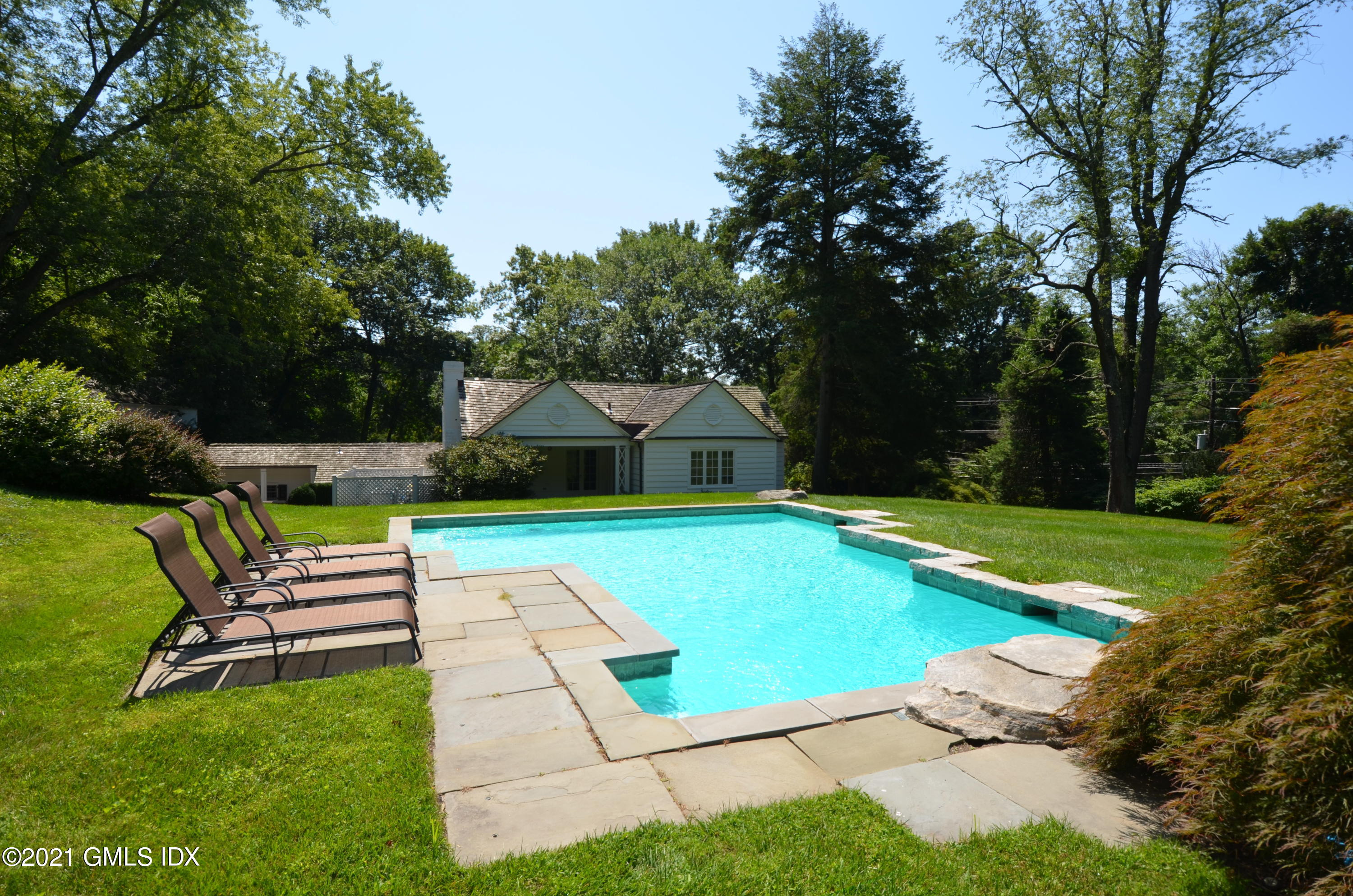 293 Riversville Road Greenwich, CT 06831 - Photo 30 of 38 a park view with a bench and trees