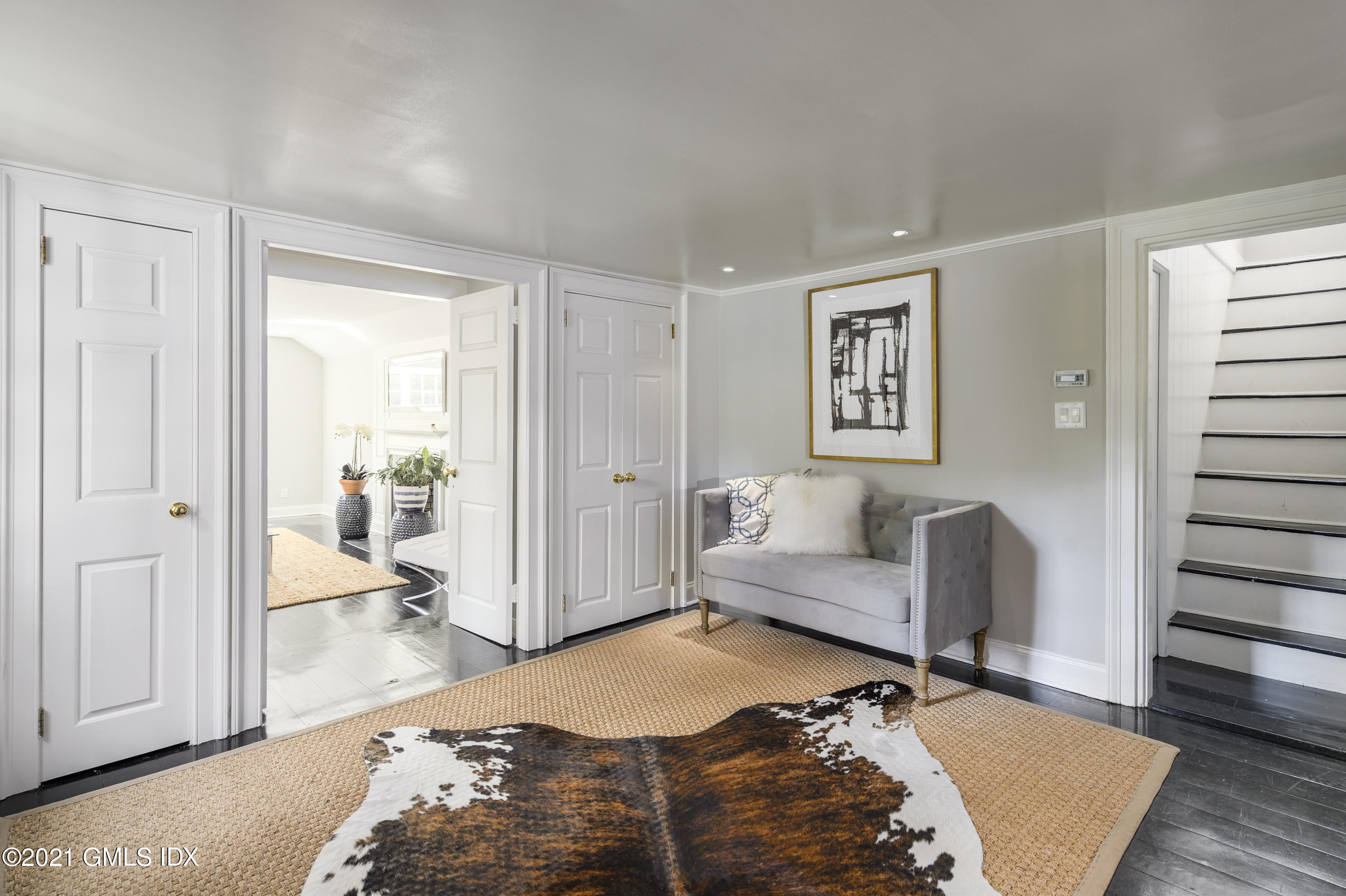 293 Riversville Road Greenwich, CT 06831 - Photo 4 of 38 a bedroom with furniture and a rug