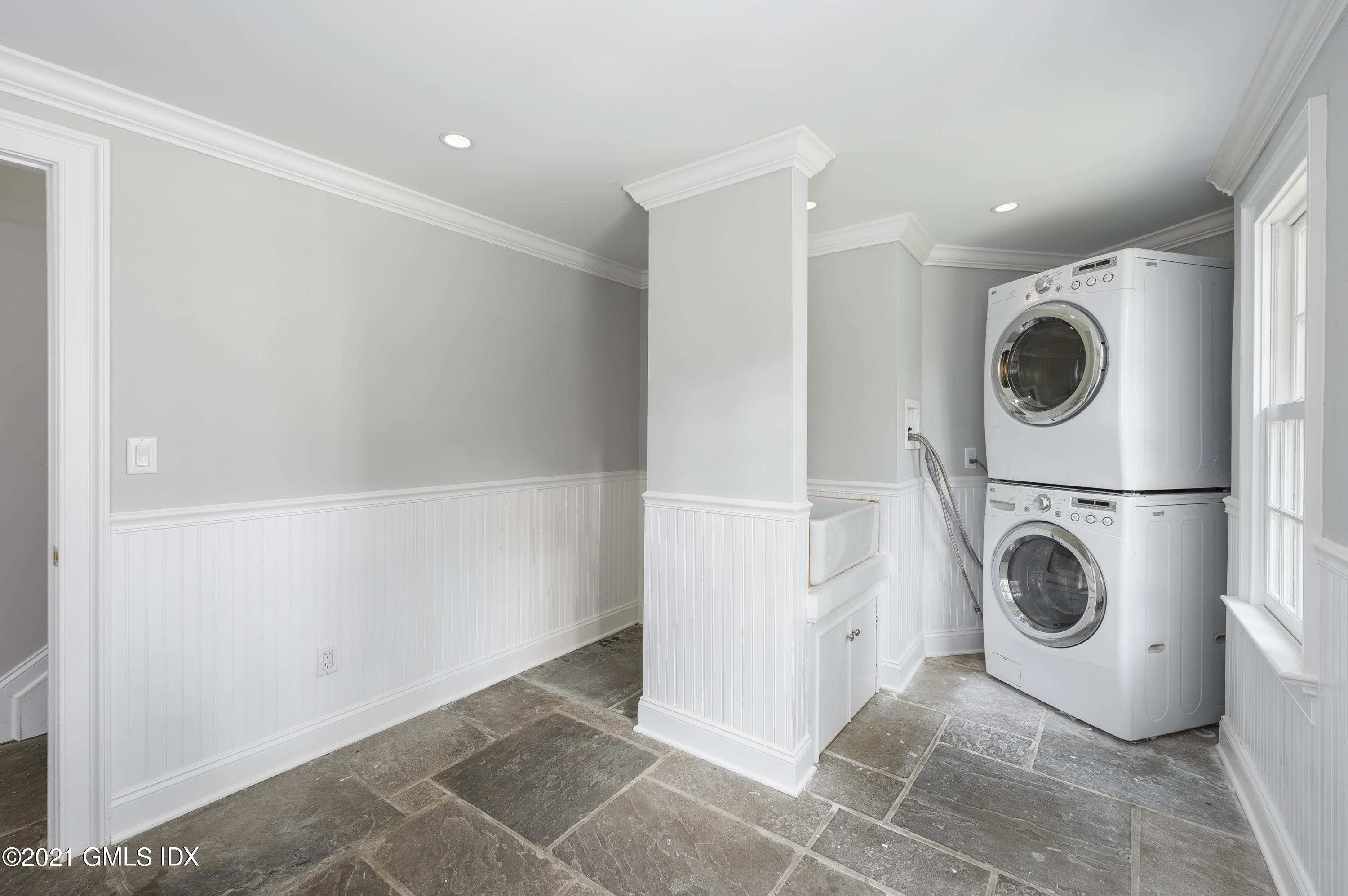 293 Riversville Road Greenwich, CT 06831 - Photo 6 of 38 a utility room with sink dryer and washer