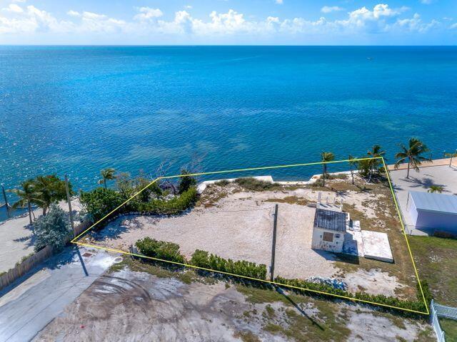 1235 83rd Street Marathon, FL 33050 - Photo 1 of 16 an aerial view of a house with a yard