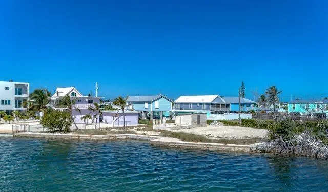 a view of a house with yard and sitting area