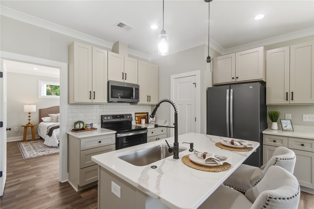 98 Turkey Trot Road Williamston, SC 29697 - Photo 13 of 18 This modern kitchen features a spacious island and sleek appliances, perfect for entertaining and everyday living.