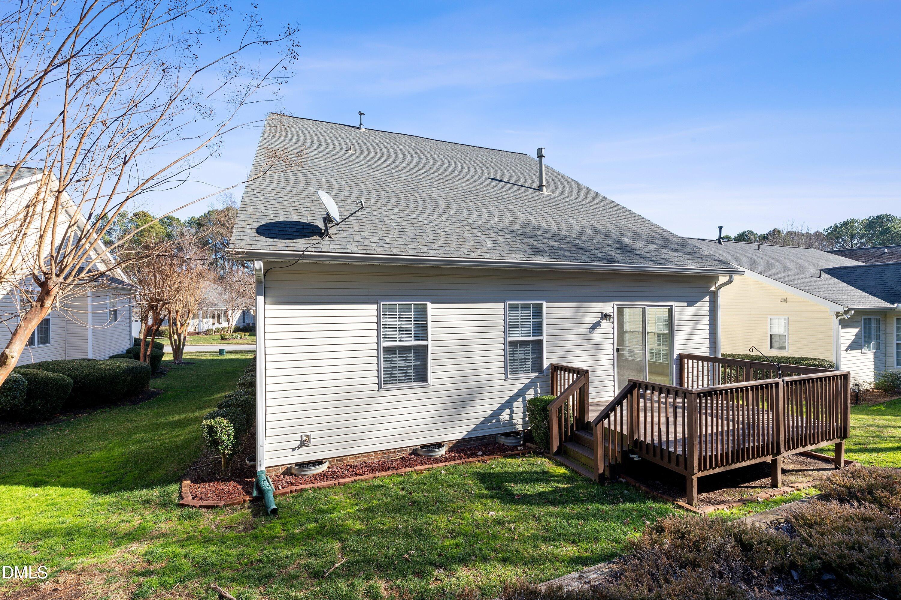 105 Rockport Ridge Way Cary, NC 27519 - Photo 38 of 43 a view of a house with a backyard and a patio