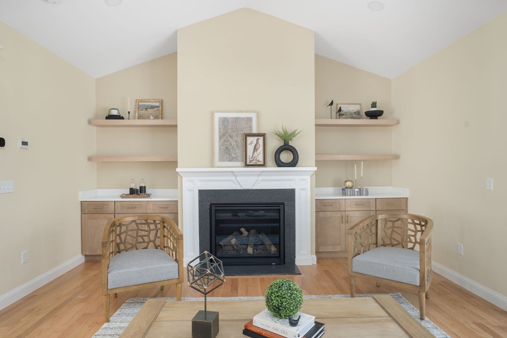 660 Pine Street Seekonk, MA 02771 - Photo 11 of 37 a living room with furniture and a fireplace