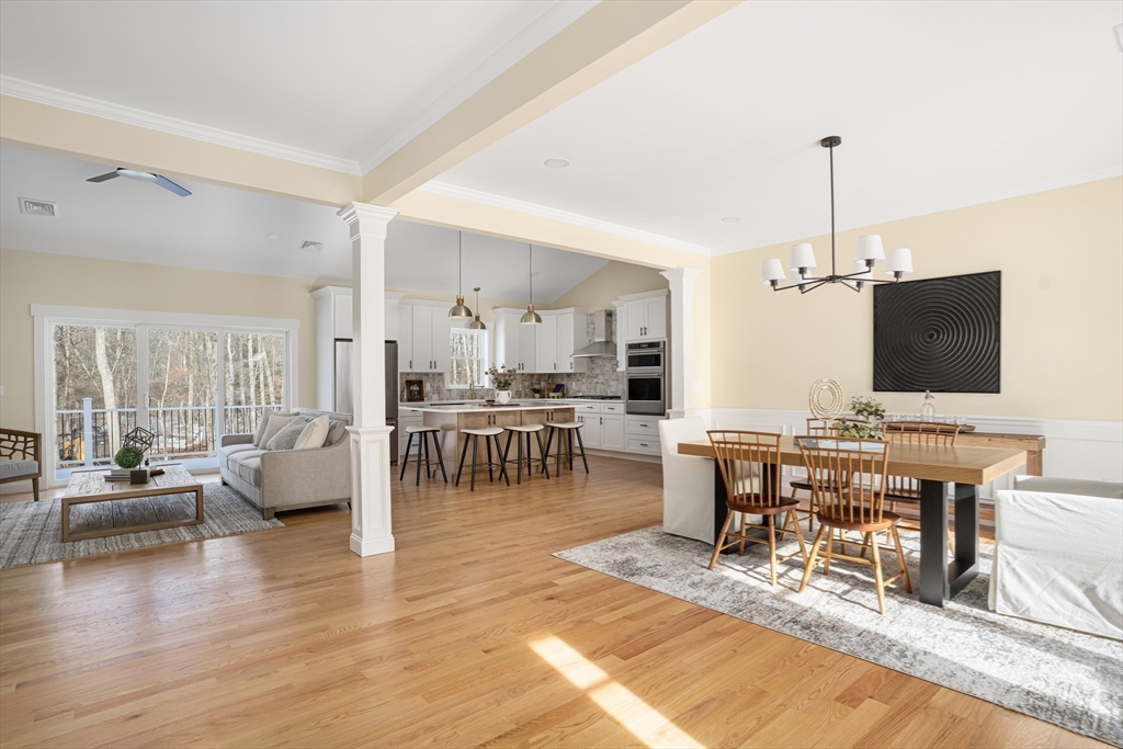 660 Pine Street Seekonk, MA 02771 - Photo 12 of 37 a living room with furniture a flat screen tv and kitchen view