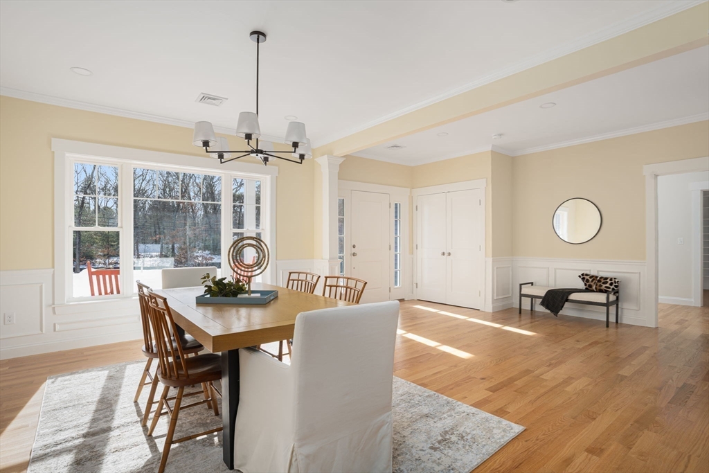 660 Pine Street Seekonk, MA 02771 - Photo 15 of 37 a dining room with furniture a chandelier and wooden floor