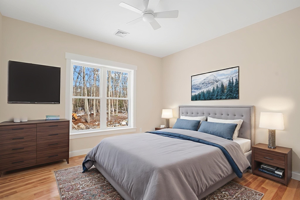 660 Pine Street Seekonk, MA 02771 - Photo 28 of 37 a bedroom with a bed and a flat screen tv