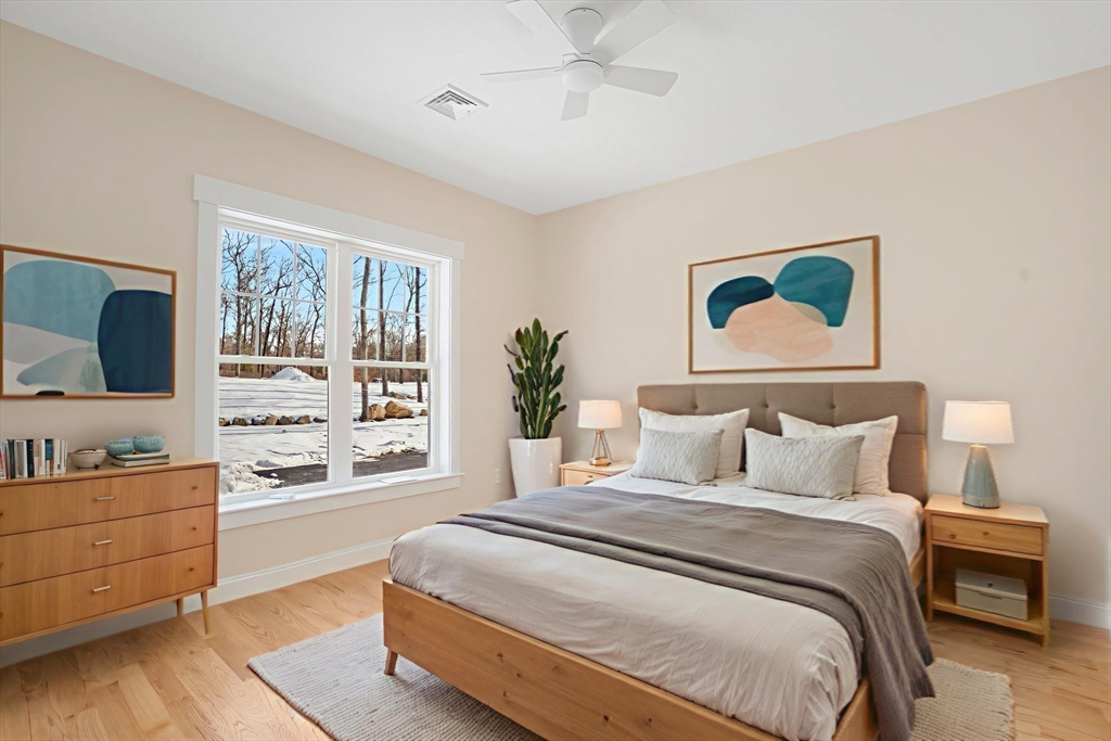 660 Pine Street Seekonk, MA 02771 - Photo 30 of 37 a bedroom with a large bed and a dresser