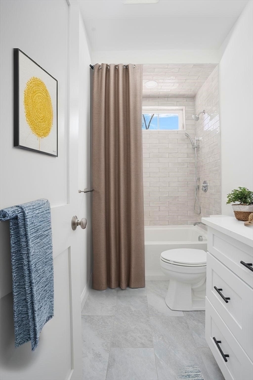 660 Pine Street Seekonk, MA 02771 - Photo 31 of 37 a bathroom with a toilet a sink and bathtub