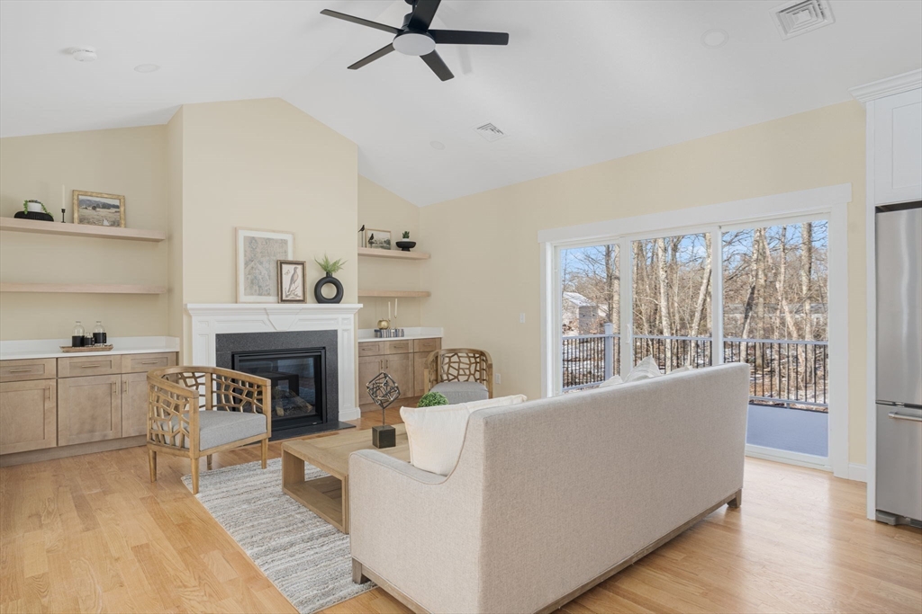660 Pine Street Seekonk, MA 02771 - Photo 10 of 37 a living room with furniture and a fireplace
