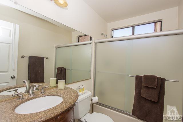 5833 Cochran Street Simi Valley, CA 93063 - Photo 12 of 28 a bathroom with a sink toilet and mirror