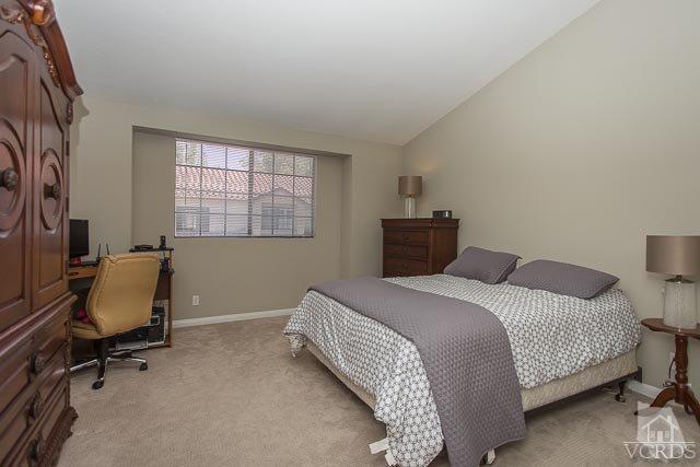 5833 Cochran Street Simi Valley, CA 93063 - Photo 13 of 28 a bedroom with a bed a desk and chair